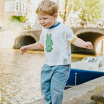 Child wearing the White Miffy children's T-shirt with green Miffy print