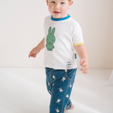 Child wearing the White Miffy children's T-shirt with green Miffy print