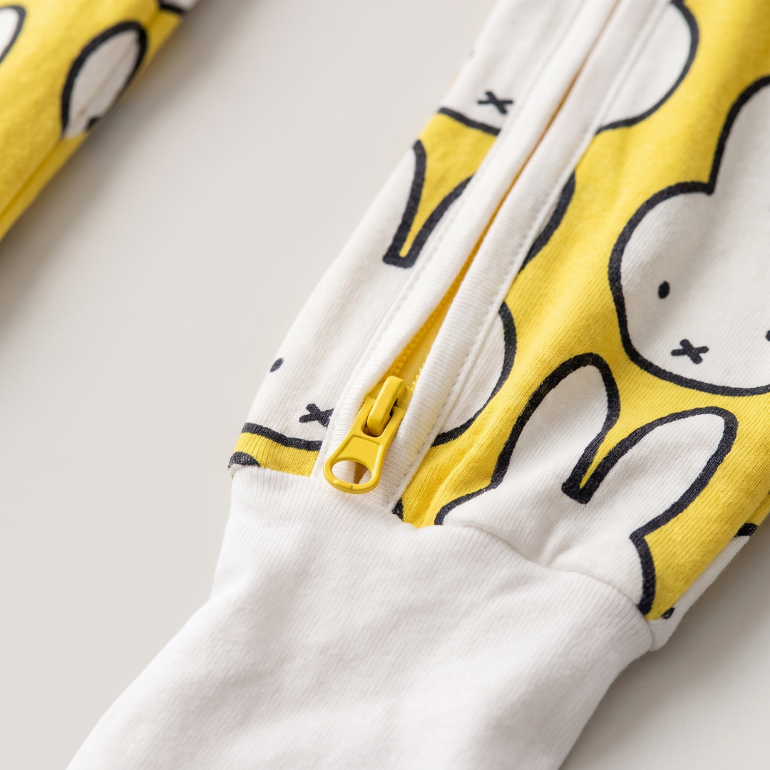 Two-way zip detail on the ZIPSTER x Miffy Hello Yellow bamboo babygrow